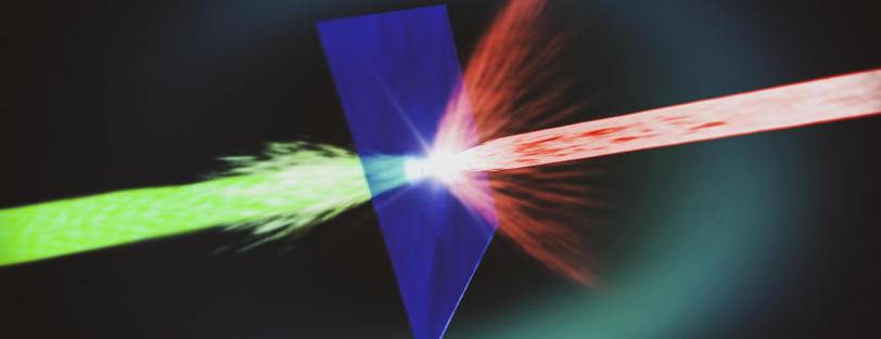 Red beam impinging on thin sheet and green beam emitting on other side